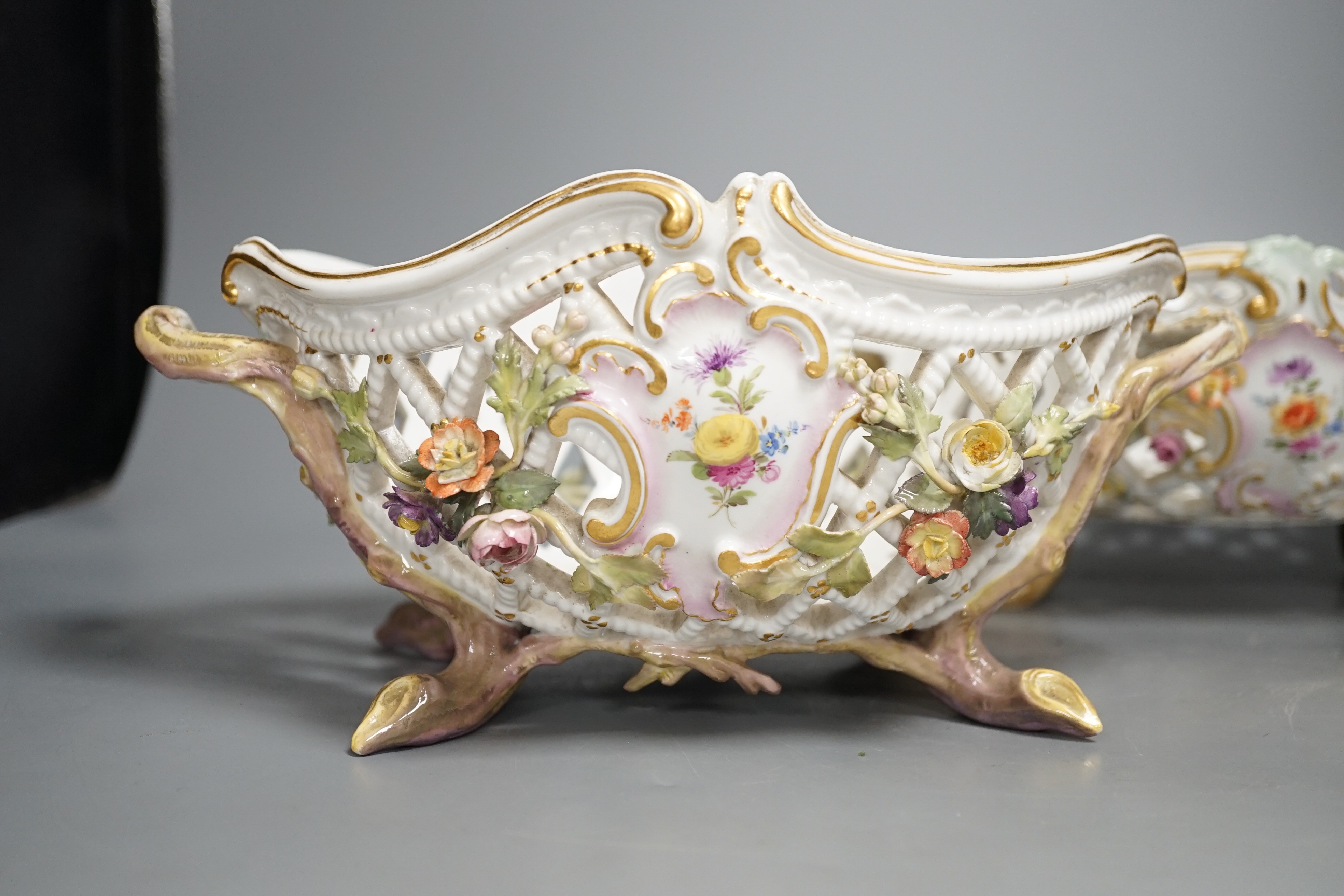 Two similar late 19th century Meissen floral encrusted pierced porcelain bowls 27cm